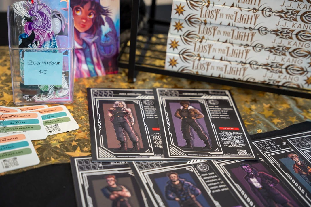 Books and illustrated cards arranged on a table.