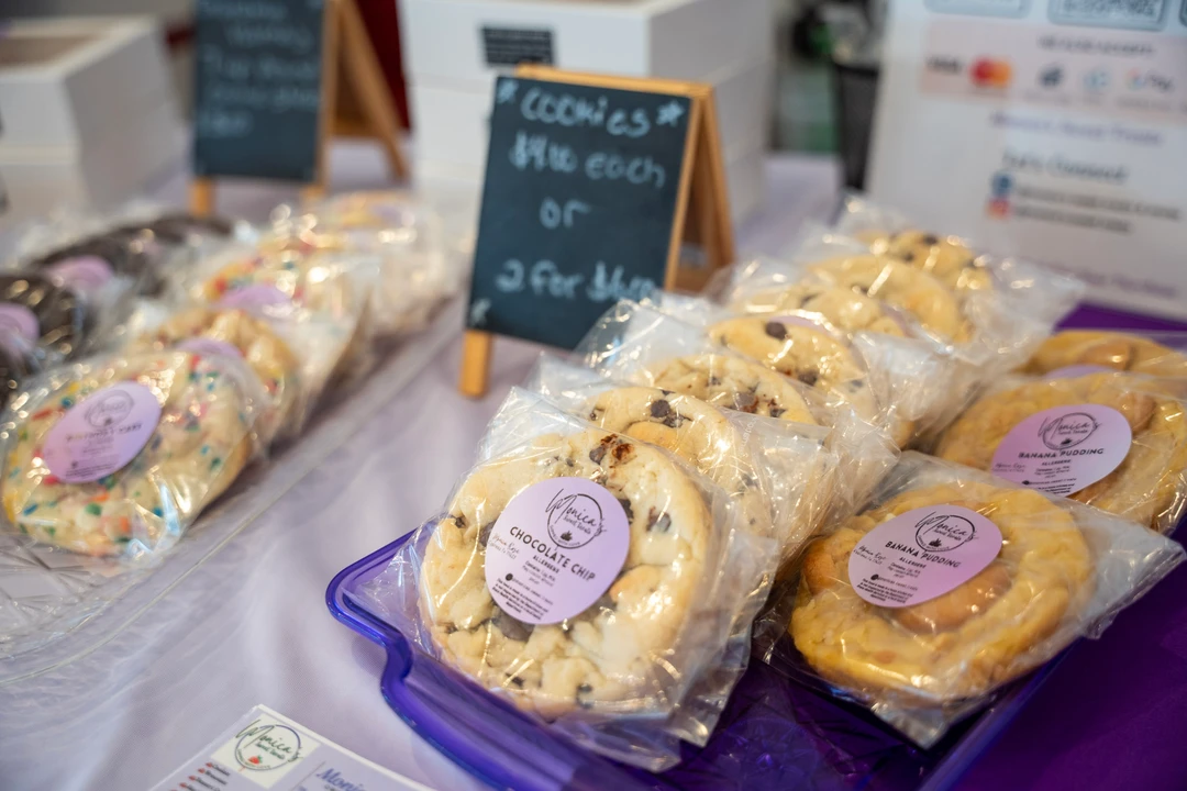 Packaged cookies arranged on a purple table runner.