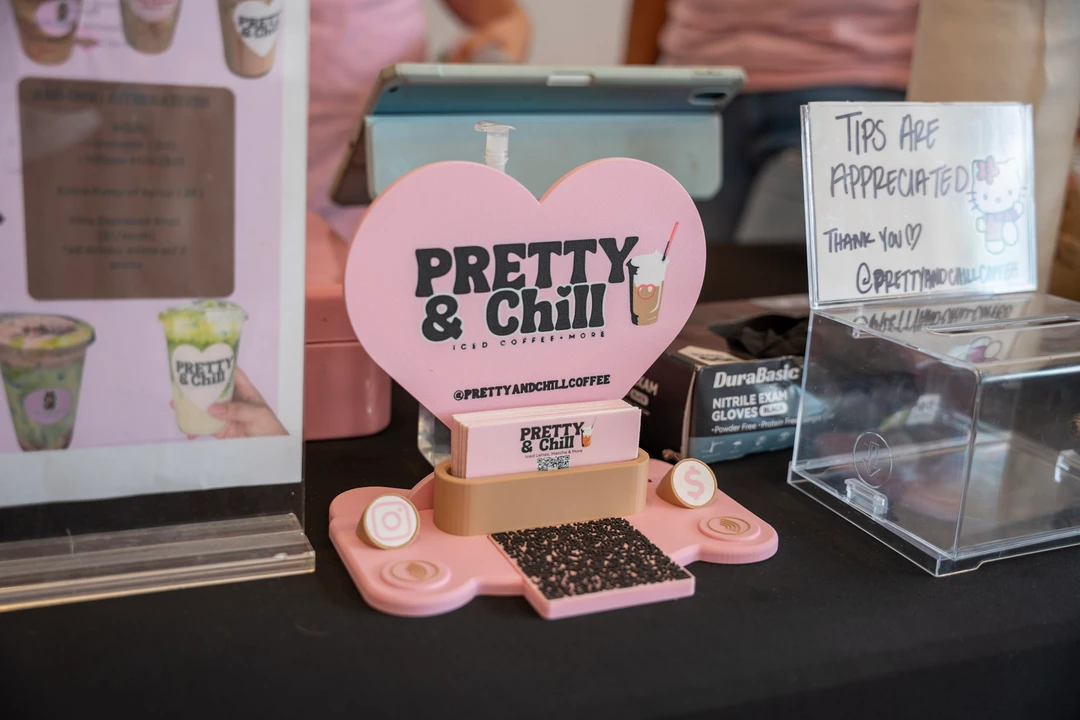 A Pretty & Chill sign and small items on a tabletop display.