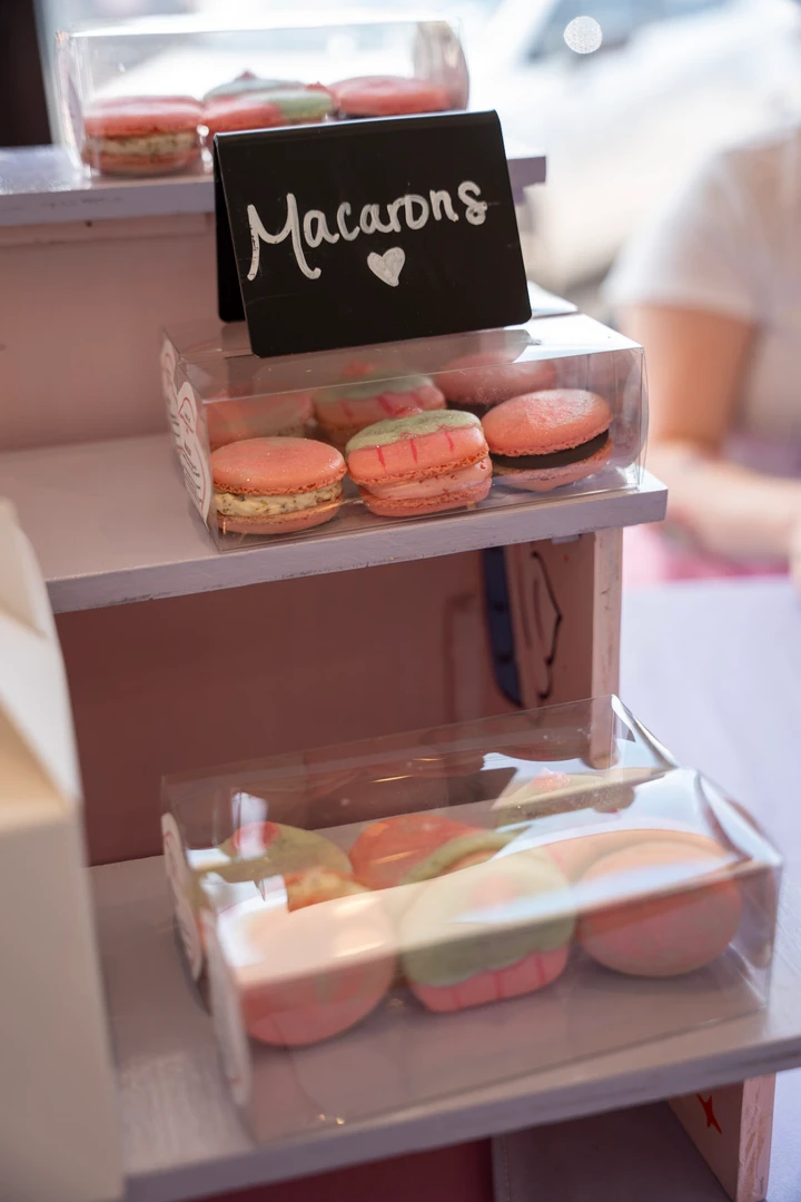 Colorful macarons in a small display case.