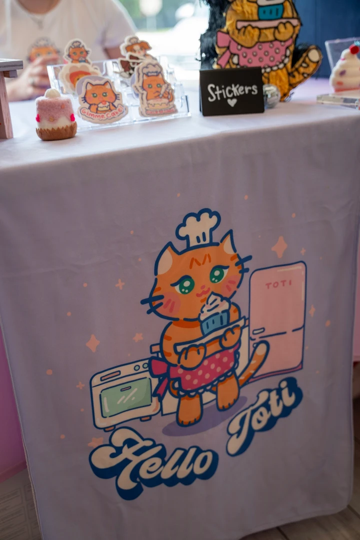 An illustrated banner beneath a dessert table.