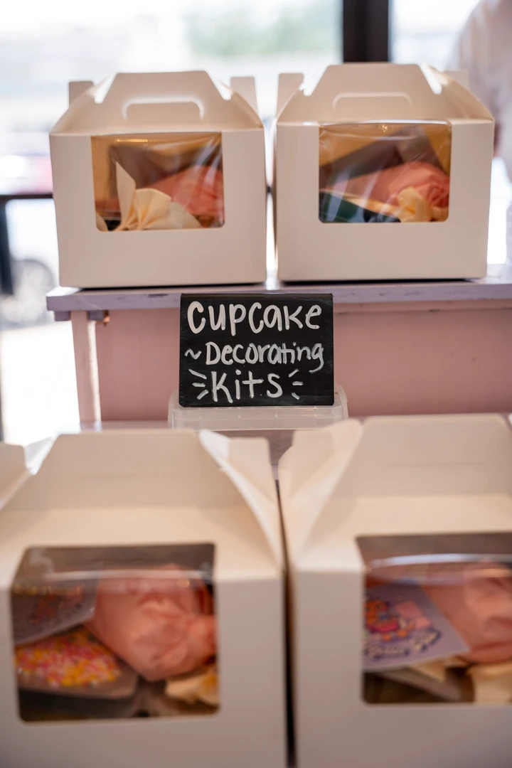 Boxed treats and a character-decorating kit sign.