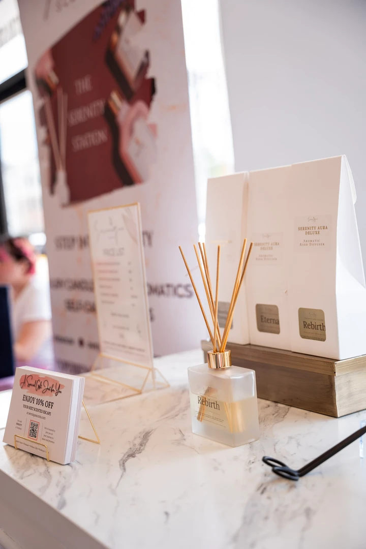 Beauty products and information cards arranged by a window.