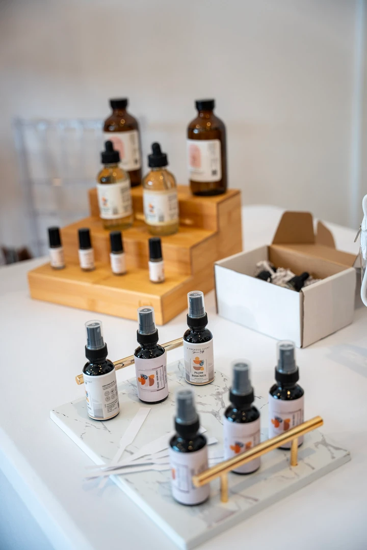 Small dropper bottles and jars on a tabletop display.