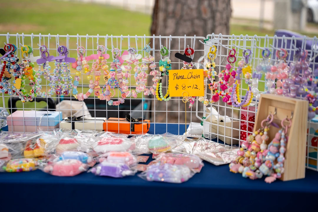 Colorful accessories and panda figures arranged on a market table.