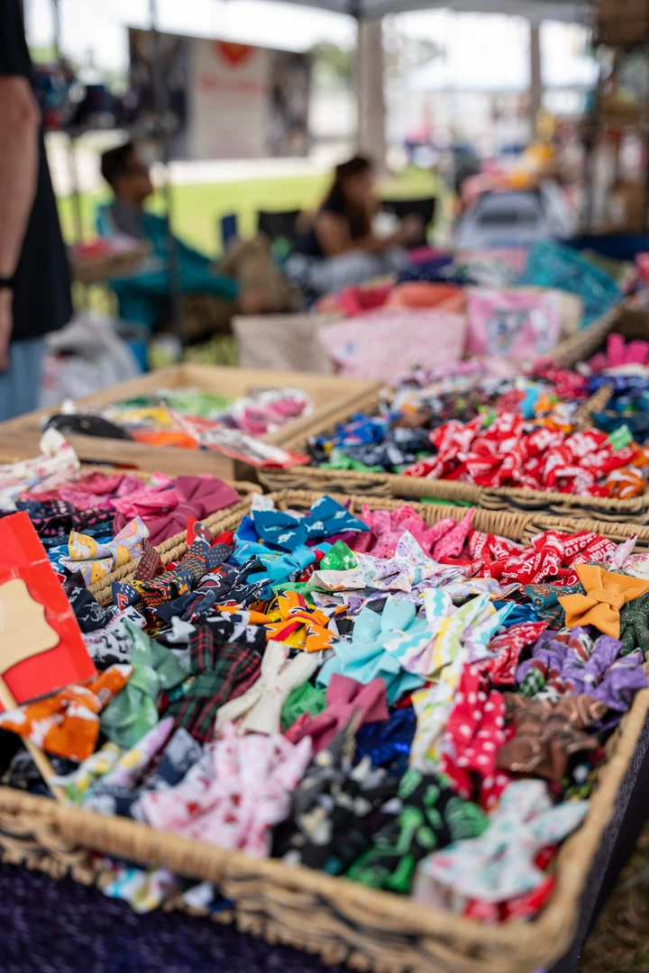 Colorful bows and accessories filling a market display.