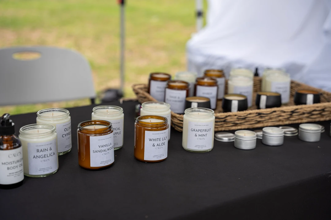Small glass jars arranged in baskets on a dark tablecloth.