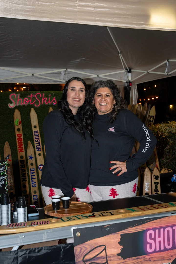 Two smiling makers at the ShotSkis stall.