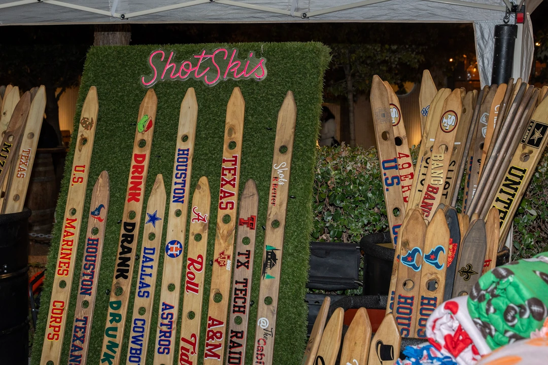 Decorated shot skis and wooden gifts at a market stall.