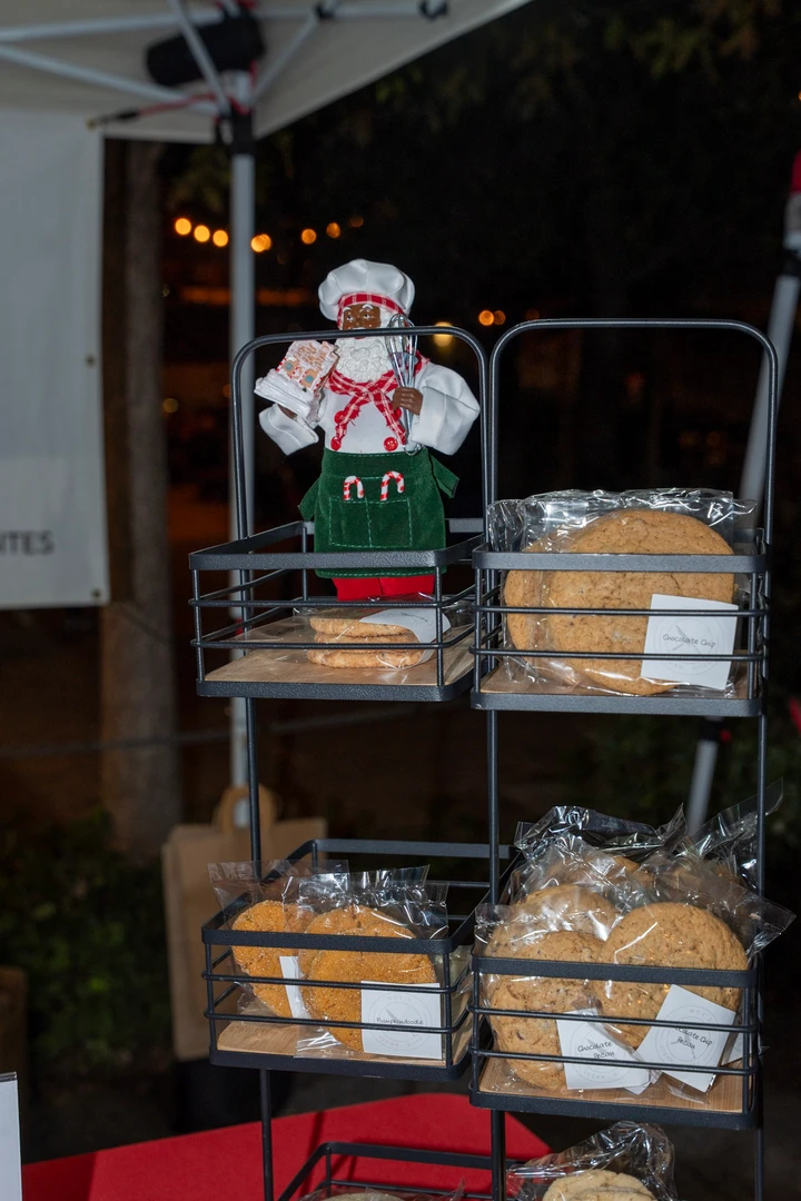 Packaged baked goods on a shelf with festive decorations.