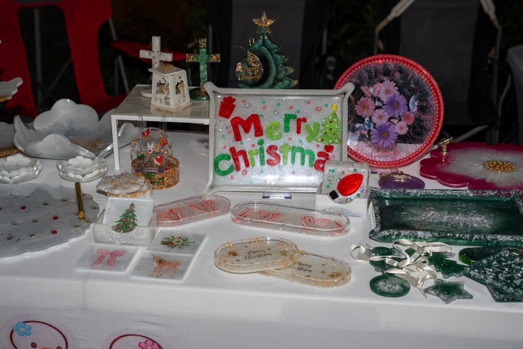 Festive gifts and decorations arranged on a market table.