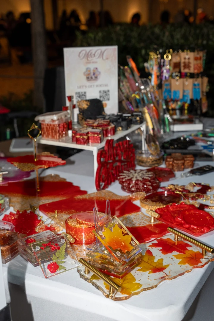 Festive gifts and decorations arranged on a market table.