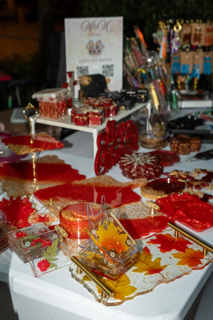 Festive gifts and decorations arranged on a market table.