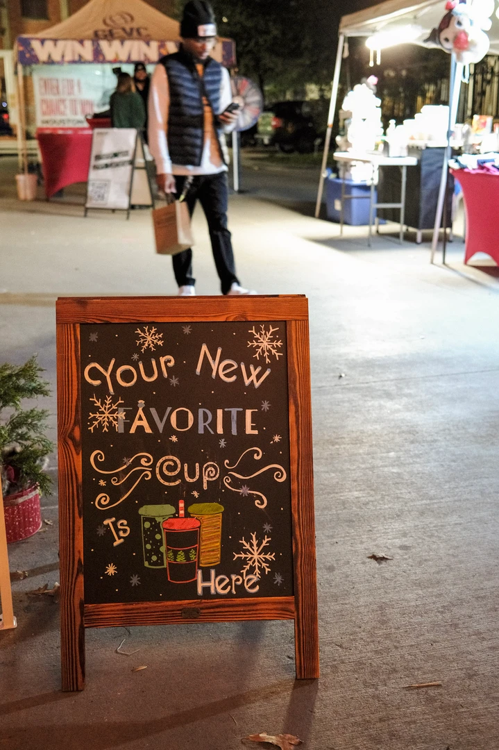 A handmade holiday market welcome sign.