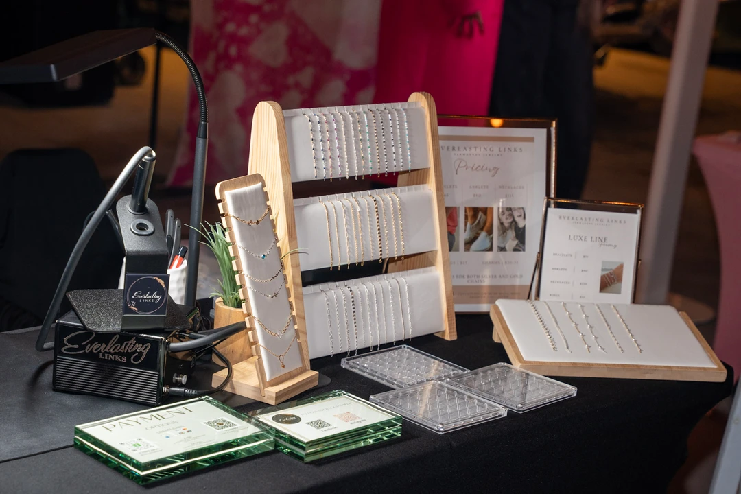 Jewelry arranged on pale display stands.
