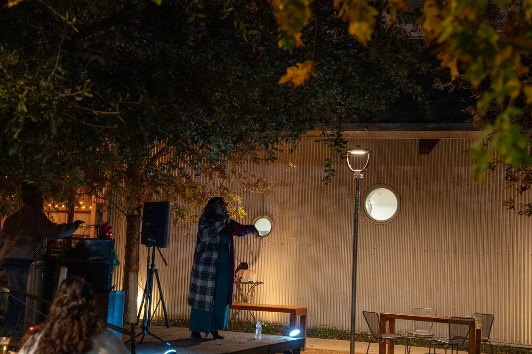 Musicians performing outdoors near the night market.