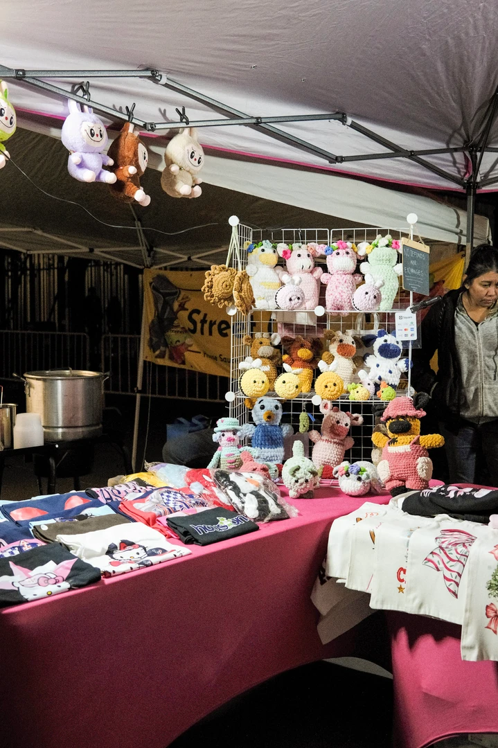 Handmade accessories and small gifts at illuminated outdoor stalls.