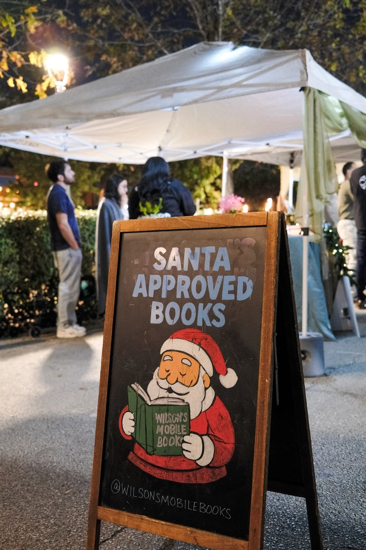 A Santa Approved Books sign outside the mobile bookshop.