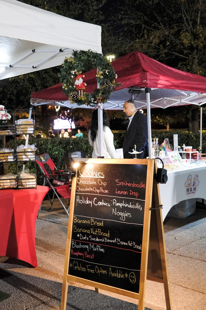A red-covered outdoor stall with a handwritten menu.