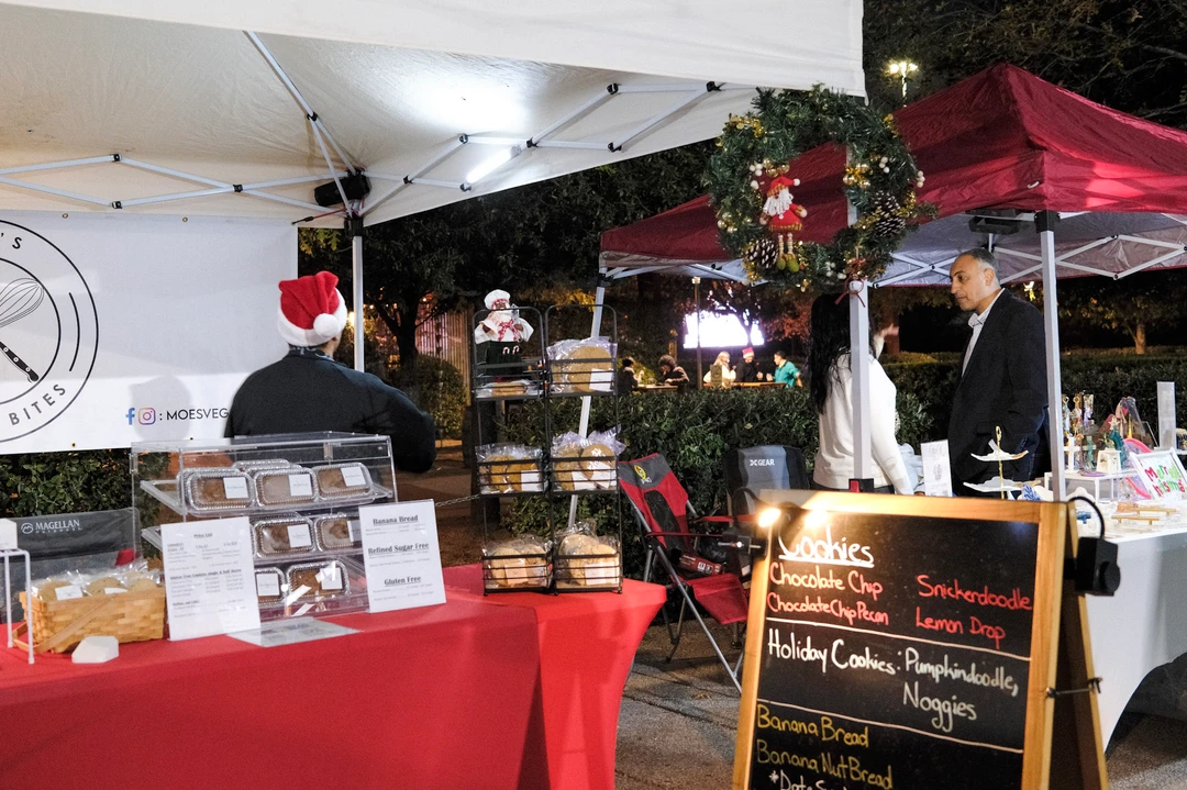 A red-covered outdoor stall with a handwritten menu.