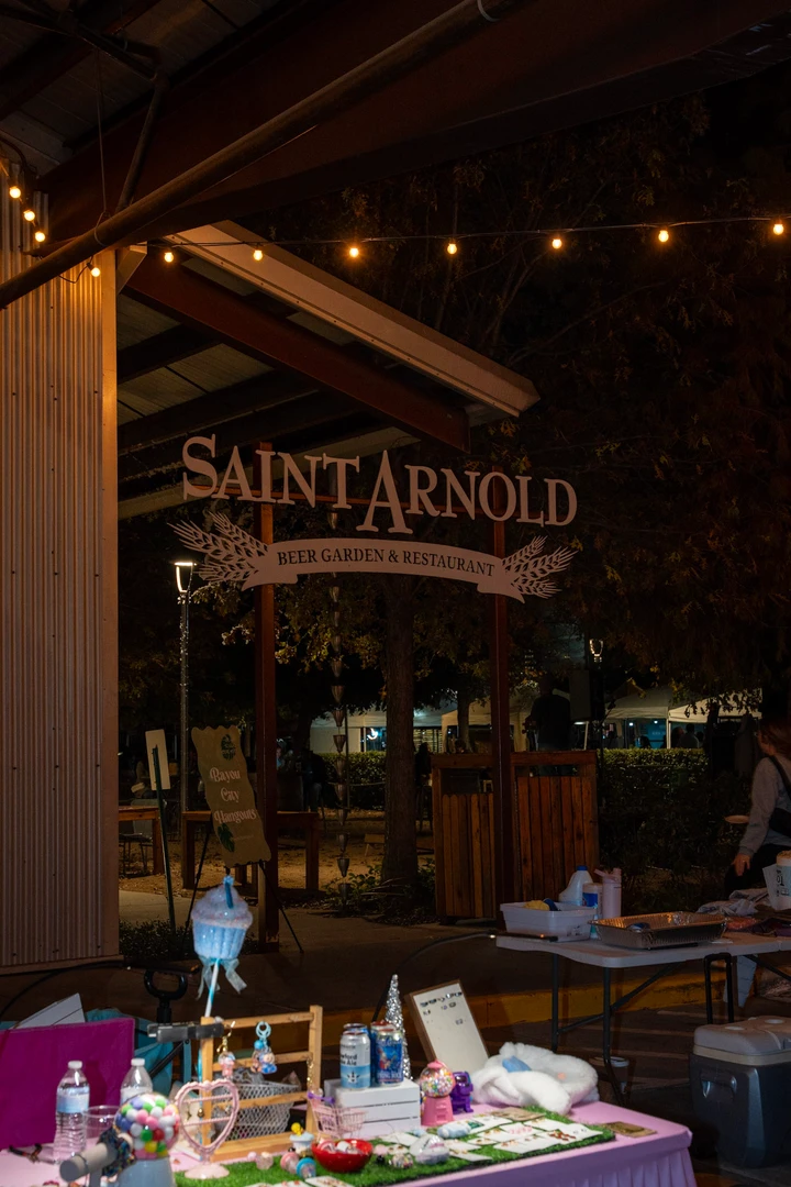 Saint Arnold signage above an indoor market display.