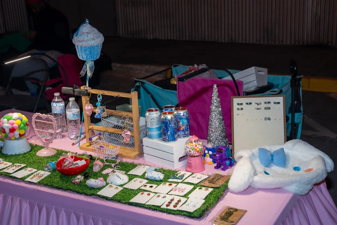 Jewelry and small gifts arranged on a colorful table.
