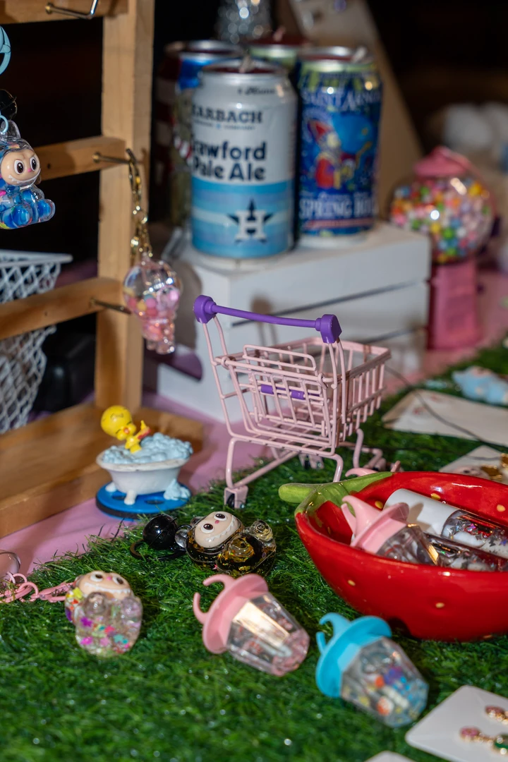 Small packaged goods filling a pink holiday market display.