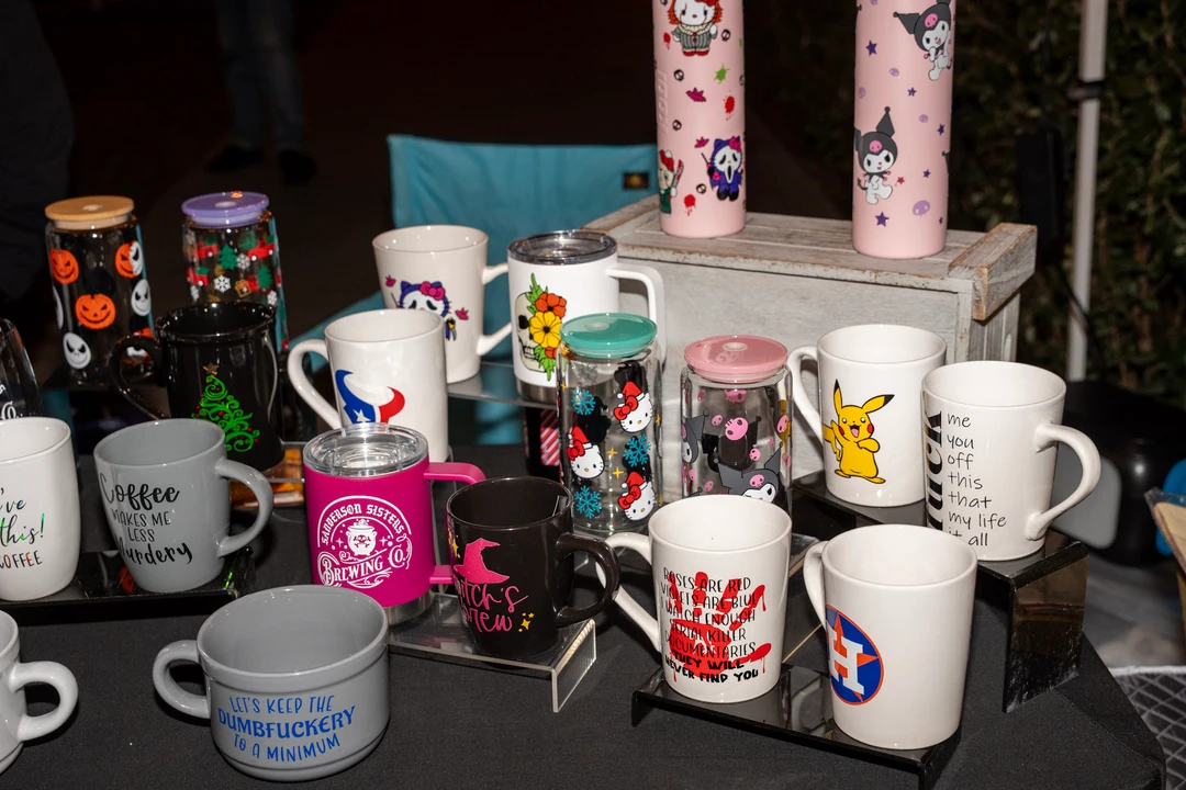 Candles, mugs and gifts arranged on display stands.