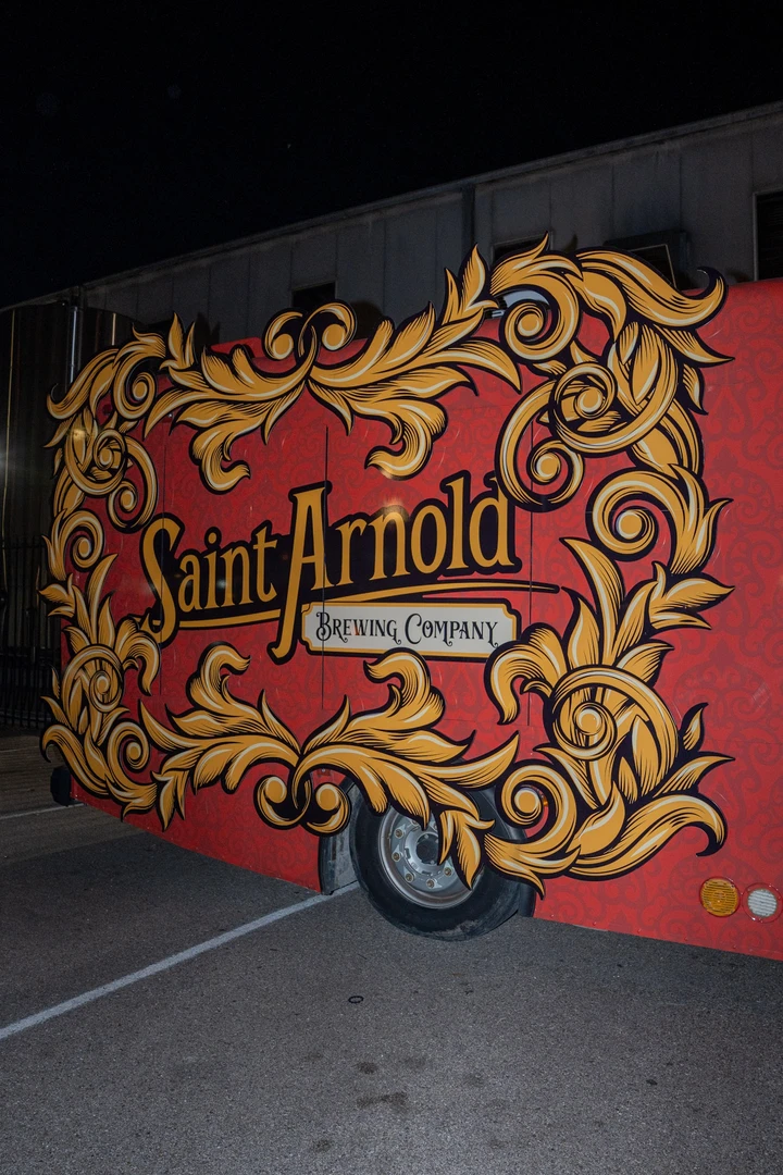 Saint Arnold branding and holiday decorations beside the market.