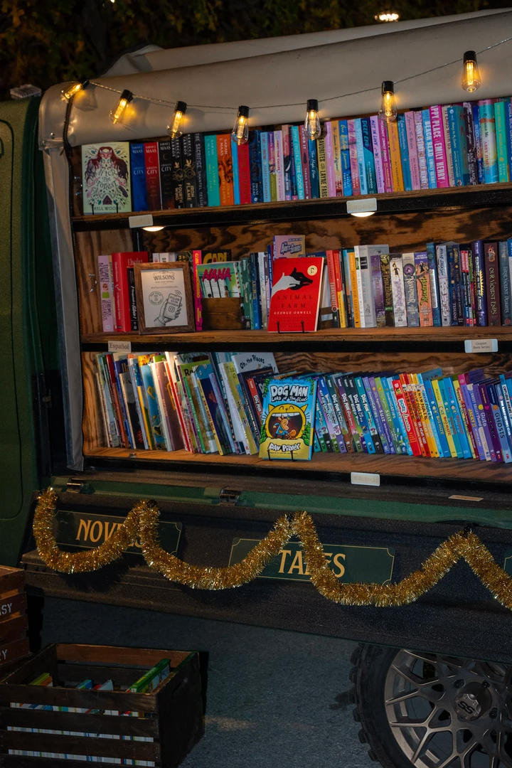 Rows of colorful books on the mobile bookshop shelves.