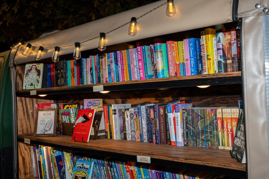 Rows of colorful books on the mobile bookshop shelves.