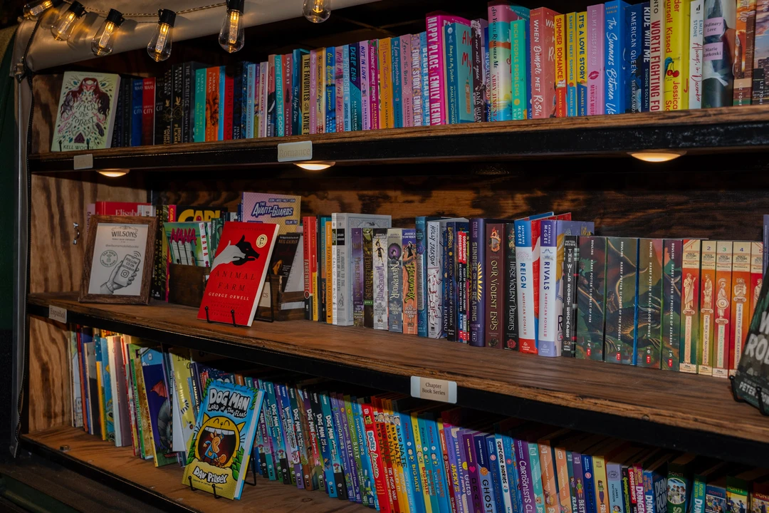 Rows of colorful books on the mobile bookshop shelves.