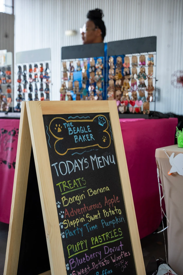A handwritten menu beside a jewelry display.