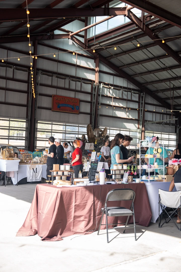 Market stalls beneath the tall indoor rafters.